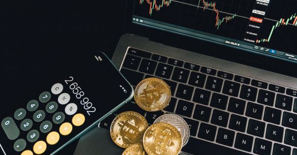 Bitcoin - Gold Coins on the Laptop