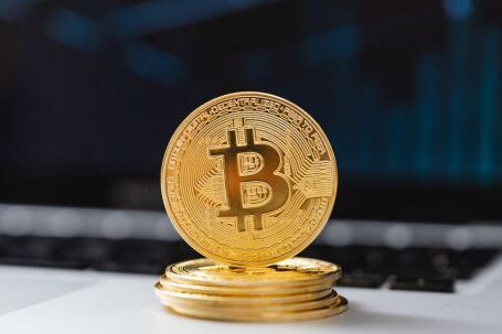 Blockchain - Selective Focus of Bitcoins on Laptop Computer