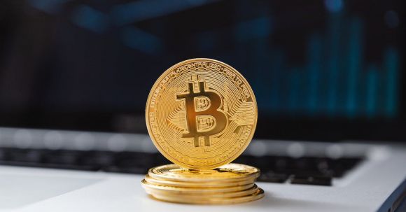 Blockchain - Selective Focus of Bitcoins on Laptop Computer