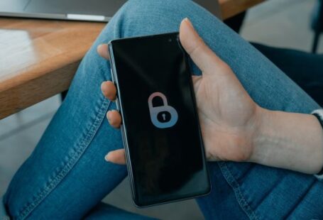 Coinbase - black and white smartphone on persons hand