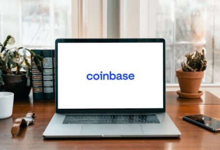 Coinbase - a laptop on a table