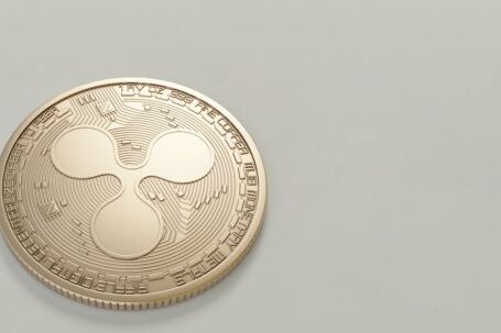 Ripple Coin - Photo of Round Gold-colored Coin