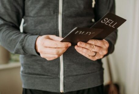 Ripple Coin - a person holding a cell phone in their hands