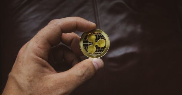 Ripple Coin - Person Holding Round Gold-colored Coin