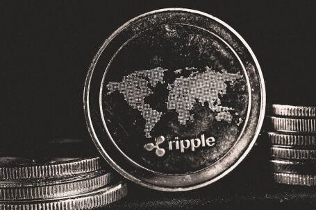 Ripple Coin - Silver Round Objects on Black Background