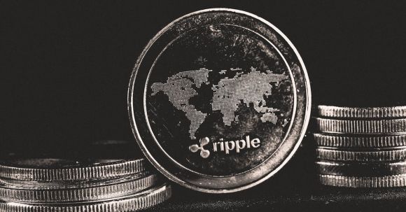 Ripple Coin - Silver Round Objects on Black Background